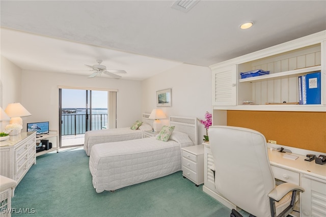 carpeted bedroom with ceiling fan and access to exterior