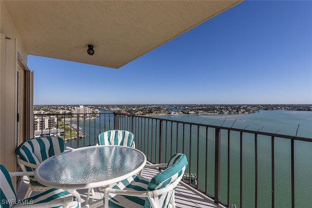 balcony featuring a water view