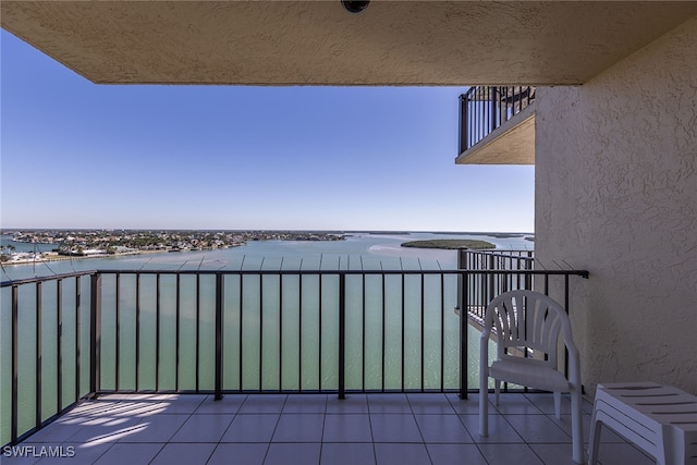 balcony featuring a water view