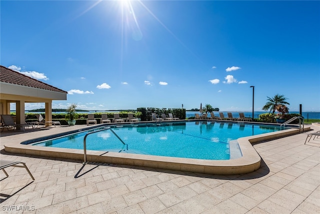 view of swimming pool with a patio