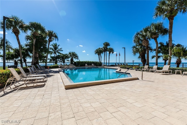 view of swimming pool with a patio