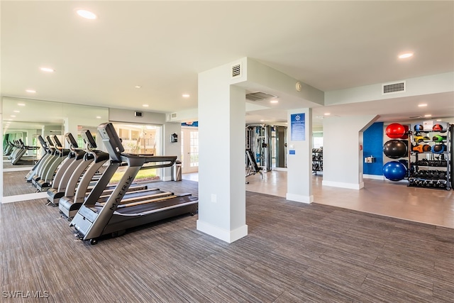 workout area featuring dark colored carpet