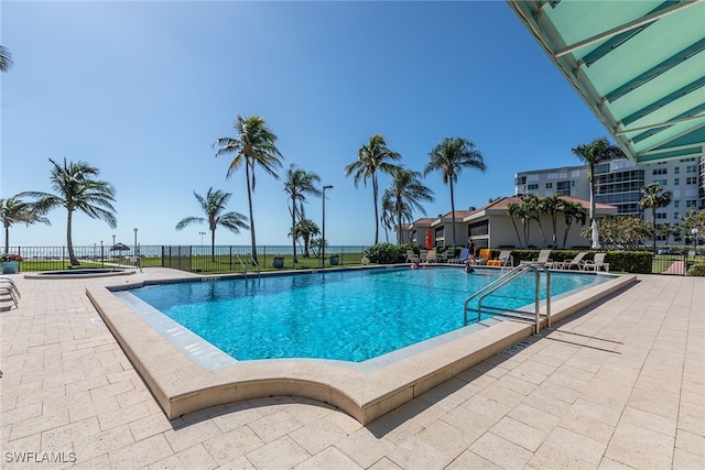 view of swimming pool featuring a patio area