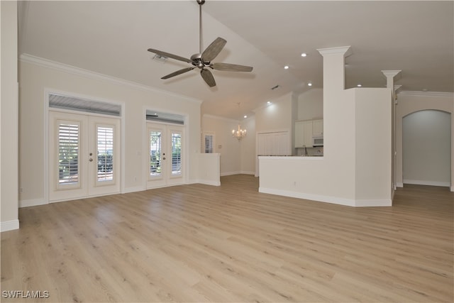 unfurnished living room with french doors, light hardwood / wood-style floors, ornamental molding, vaulted ceiling, and ceiling fan with notable chandelier