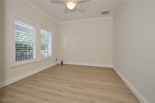 empty room with ornamental molding, light hardwood / wood-style flooring, and ceiling fan