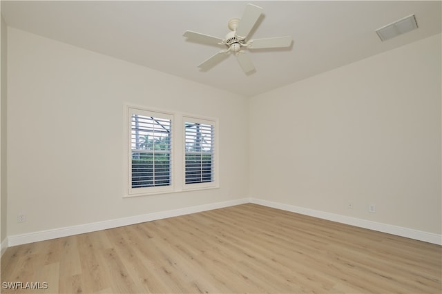 empty room with light hardwood / wood-style floors and ceiling fan