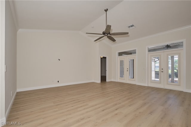 unfurnished room with light hardwood / wood-style floors, lofted ceiling, french doors, and crown molding