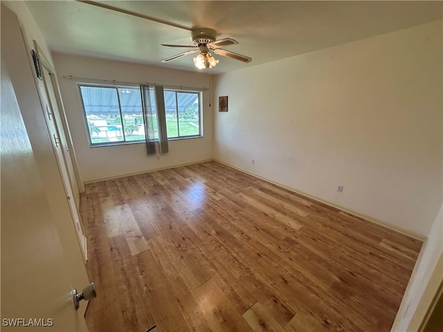 empty room featuring ceiling fan and light wood-type flooring