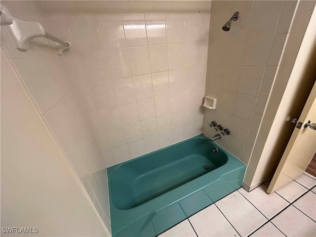 bathroom featuring tile patterned floors and tiled shower / bath