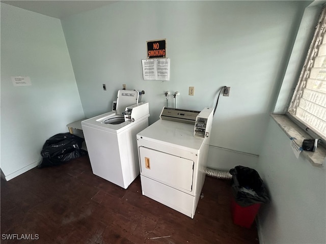 laundry room featuring dark hardwood / wood-style flooring and washer and clothes dryer