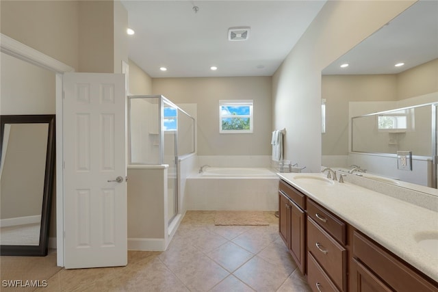 9221 Quartz Ln Unit 9-202, Naples, FL 34120 - bathroom featuring a shower stall, a bath, double vanity, tile patterned flooring, and recessed lighting