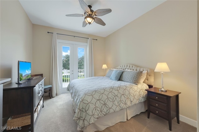 carpeted bedroom featuring access to outside, lofted ceiling, and ceiling fan