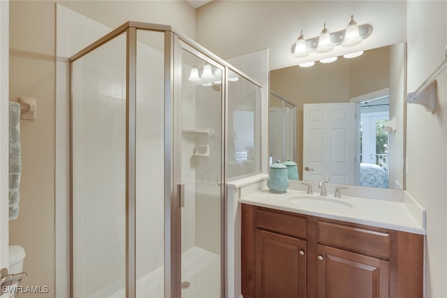 9221 Quartz Ln Unit 9-202, Naples, FL 34120 - bathroom with connected bathroom, vanity, a stall shower, and toilet