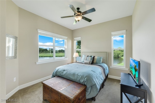 carpeted bedroom with ceiling fan