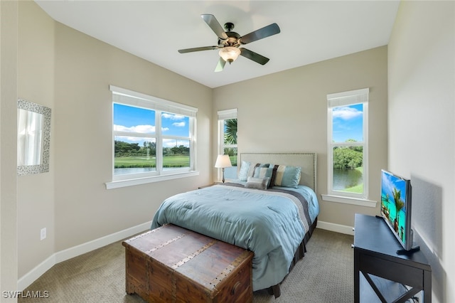 9221 Quartz Ln Unit 9-202, Naples, FL 34120 - carpeted bedroom with baseboards and ceiling fan