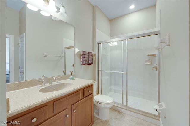 9221 Quartz Ln Unit 9-202, Naples, FL 34120 - full bath featuring toilet, a stall shower, vanity, and tile patterned floors