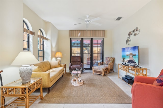 tiled living room featuring ceiling fan