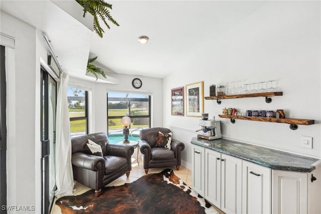 sitting room with light tile patterned floors