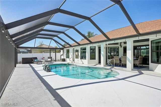 view of pool featuring a lanai, a patio area, an outdoor hangout area, and a fenced in pool