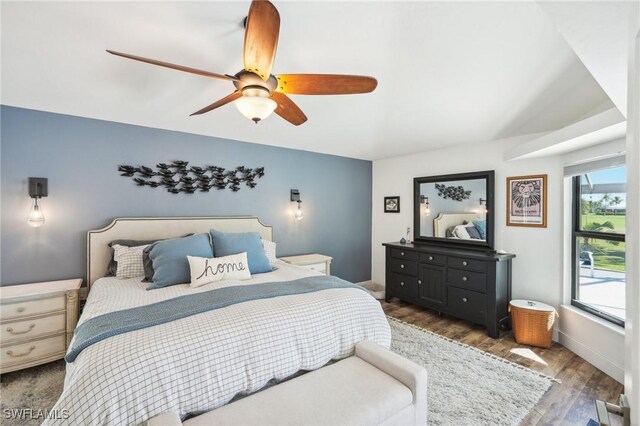 bedroom with ceiling fan and wood finished floors