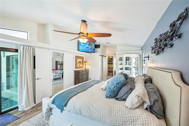 bedroom with a ceiling fan, vaulted ceiling, wood finished floors, and french doors