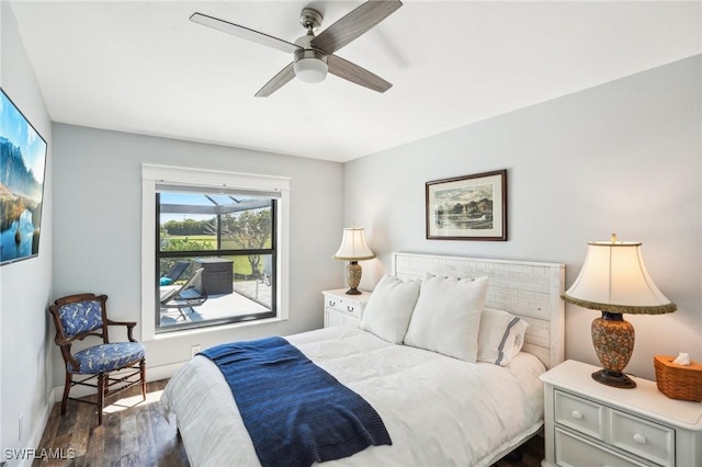 bedroom with dark wood-style floors, ceiling fan, and baseboards