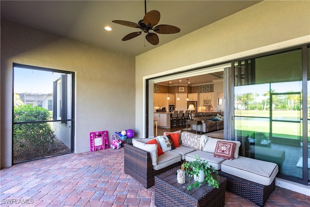 sunroom / solarium with ceiling fan