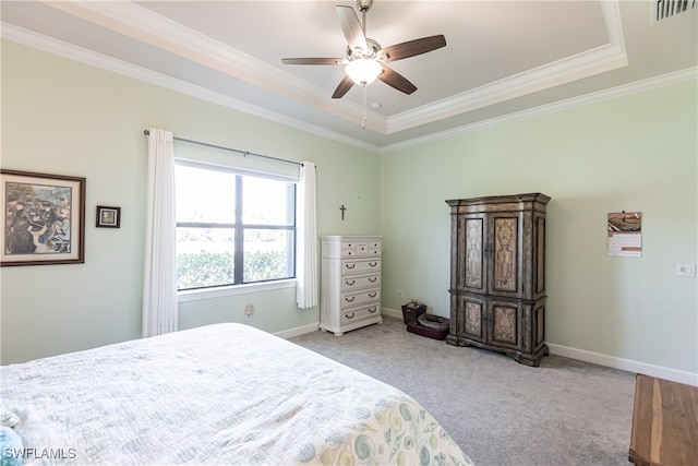 bedroom featuring light colored carpet, ceiling fan, a raised ceiling, and crown molding