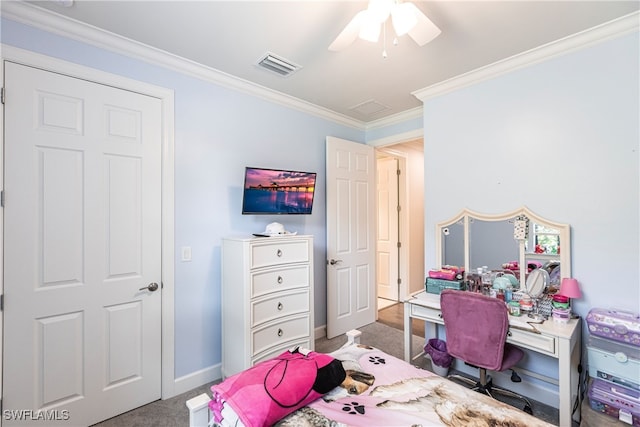 carpeted bedroom with ceiling fan and crown molding