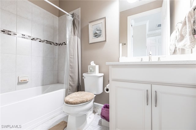 full bathroom featuring shower / bath combo with shower curtain, tile patterned floors, vanity, and toilet