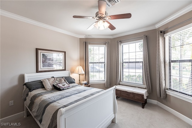 bedroom featuring light carpet, multiple windows, ceiling fan, and crown molding