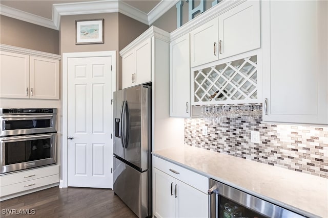 kitchen with white cabinets, beverage cooler, stainless steel appliances, and dark hardwood / wood-style flooring