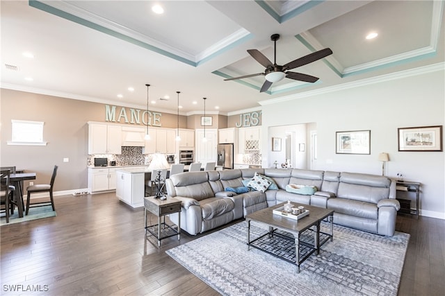 living room featuring coffered ceiling, beam ceiling, ceiling fan, ornamental molding, and dark hardwood / wood-style floors