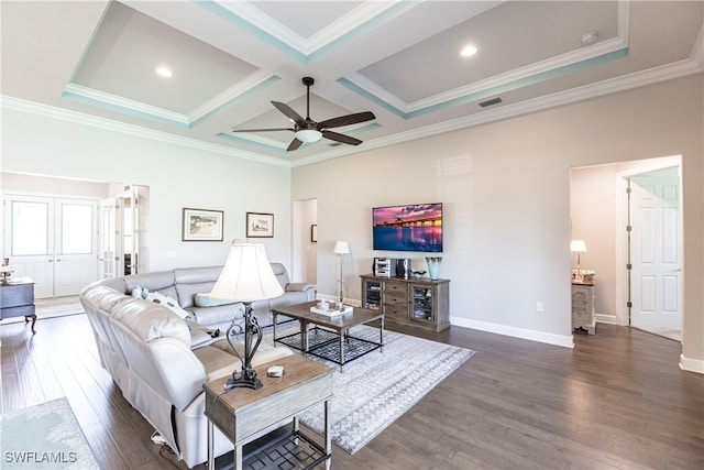 living room featuring ceiling fan, crown molding, dark hardwood / wood-style flooring, and coffered ceiling