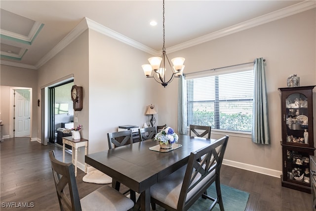 dining area featuring dark hardwood / wood-style floors, ornamental molding, and a chandelier