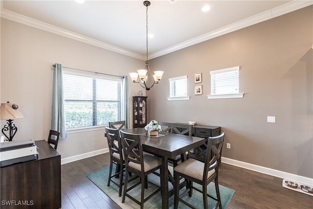 dining room featuring ornamental molding, a wealth of natural light, an inviting chandelier, and dark hardwood / wood-style flooring