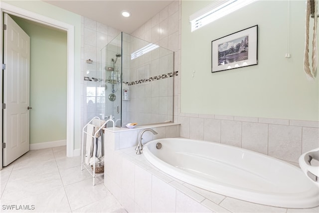 bathroom featuring independent shower and bath and tile patterned floors