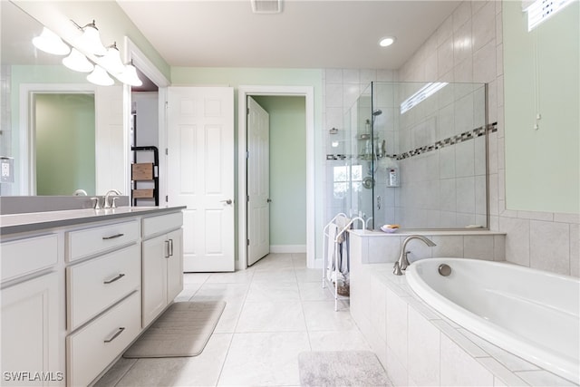 bathroom with shower with separate bathtub, tile patterned floors, and vanity