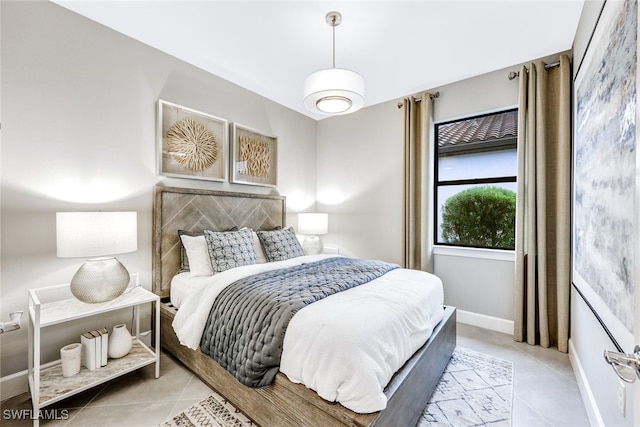 bedroom with light tile patterned floors