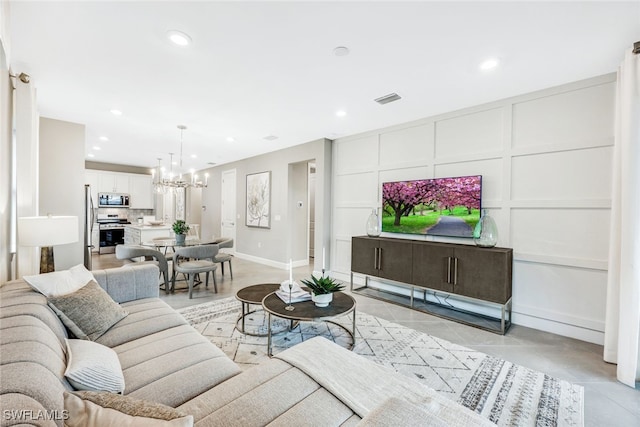 living room featuring a chandelier