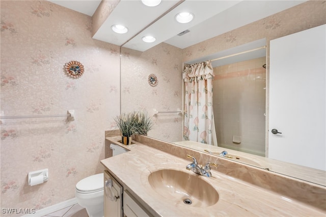 bathroom with vanity, toilet, and tile patterned floors