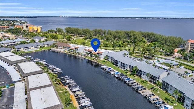 birds eye view of property featuring a water view