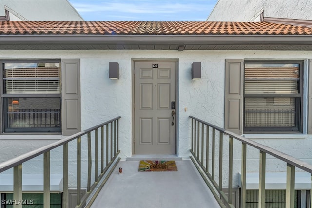 entrance to property with a balcony