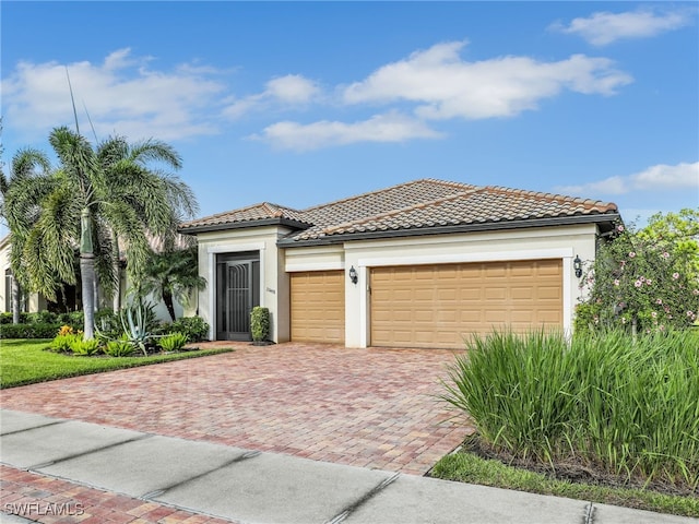 mediterranean / spanish house featuring a garage