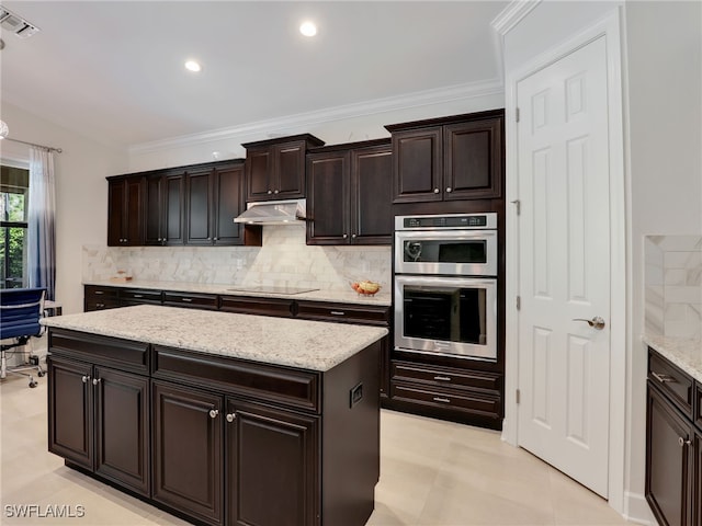 kitchen featuring black electric stovetop, crown molding, double oven, and tasteful backsplash