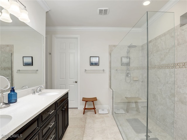 bathroom featuring tile patterned floors, crown molding, vanity, and tiled shower