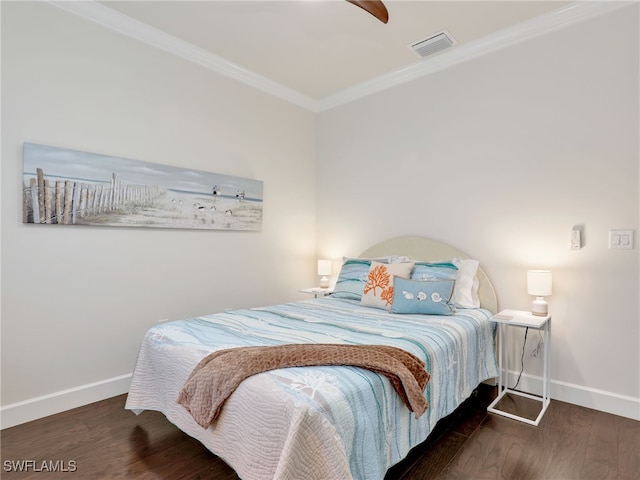 bedroom featuring ceiling fan, dark hardwood / wood-style flooring, and crown molding