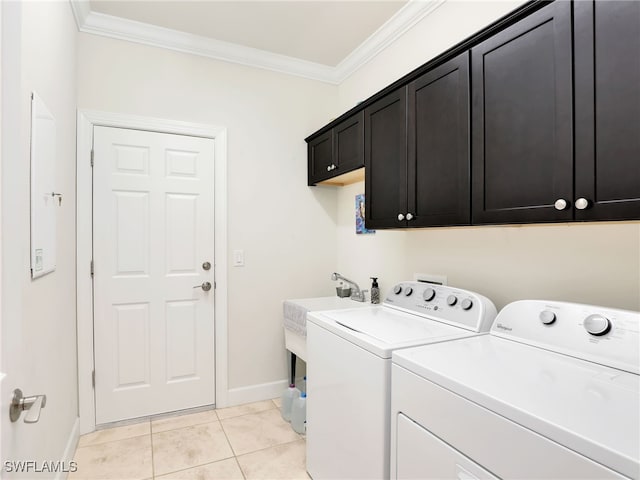 laundry area with washer and dryer, light tile patterned flooring, cabinets, and ornamental molding