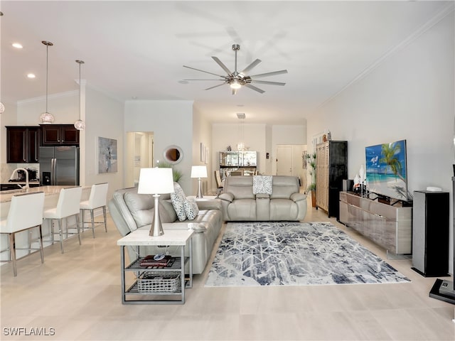 living room featuring crown molding, sink, ceiling fan, and lofted ceiling