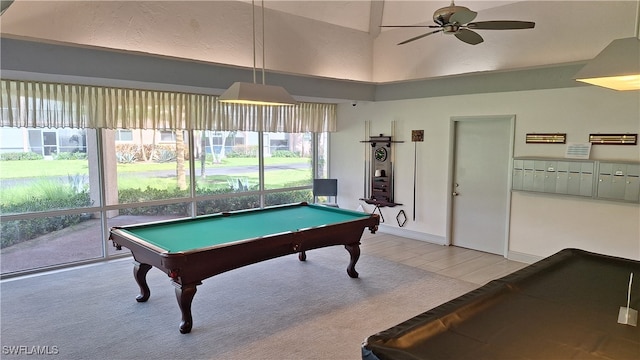 recreation room with a wealth of natural light, ceiling fan, a towering ceiling, and billiards